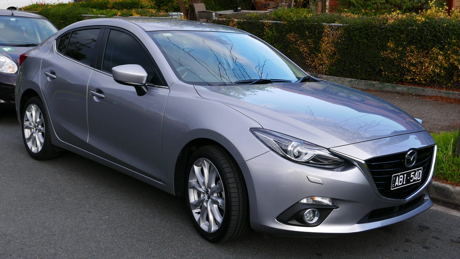 A 2014 Mazda 3 SP25 GT sedan. We buy every Mazda 3 in any condition, with a free instant valuation, free pickup Australia-wide, and same-day payment.